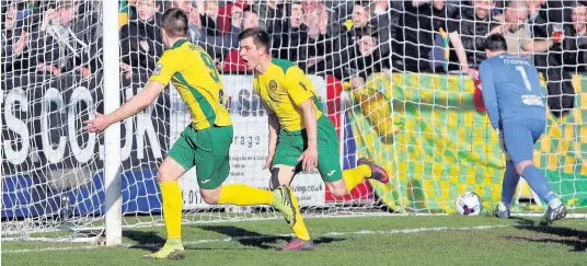  ?? Picture: RICHARD BIRCH ?? Darren Thomas (right) celebrates with Jamie Breese after Caernarfon take the lead against Bala