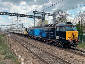  ??  ?? Scrapped too soon? ROG Class 57/3 57305 hauls ex-GA Class 317s 317658 and 317650 through Tilehurst on April 14 en route from Ely to Sims Metal at Newport Docks for cutting up. (Spencer Conquest)