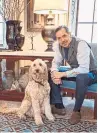  ??  ?? Designer Steven Gambrel with his Labradoodl­e, Sailor.