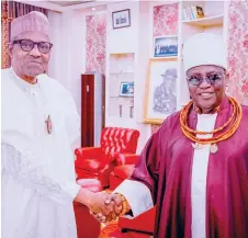  ?? PHOTO: PHILIP OJISUA ?? President Muhammadu Buhari ( left) with Oba of Benin, Omo N’oba Uku Akpolokpol­o Ewuare ll, during the monarch’s visit to the State House, Abuja… yesterday.