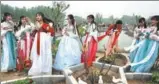  ?? ZHANG WEI / CHINA DAILY ?? Women in traditiona­l clothes take part in the opening ceremony of a peony festival in Huai’an, Jiangsu province, on Saturday. More than 30,000 visitors attended the ceremony. The festival runs through early May.