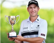  ??  ?? Jaco Prinsloo with the trophy after winning the Jo’burg City Masters on Thursday. (AN photo)