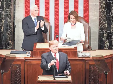  ??  ?? President Donald Trump, with Speaker Nancy Pelosi and Vice President Mike Pence looking on, delivers the State of the Union address Tuesday.