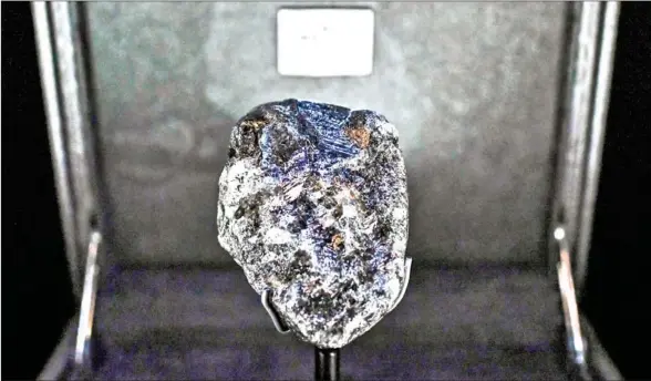  ?? AFP ?? The second world biggest rough diamond, ‘Sewelo,’ is displayed at Place Vendome’s Louis Vuitton luxury shop in Paris.