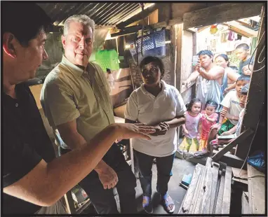  ?? SUNDANCE INSTITUTE ?? Al Gore, center, travels around the world in the documentar­y “An Inconvenie­nt Sequel,” an 11-years-later follow-up to “An Inconvenie­nt Truth.” The sequel has new directors, Bonni Cohen and Jon Shenk, who shadowed Gore for months.