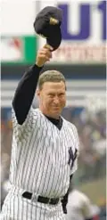  ?? AP ?? Mel Stottlemyr­e waves to crowd after throwing out first pitch on Opening Day, 2001.