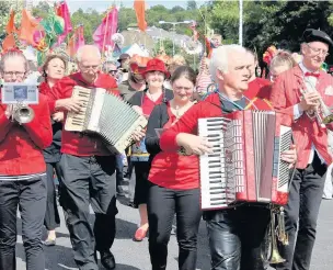  ??  ?? The Bamboozle Band is led through the streets by Loz Kaye