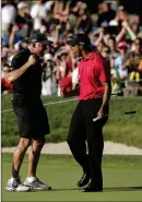  ?? ASSOCIATED PRESS ?? IN THIS JUNE 15, 2008, file photo, Tiger Woods celebrates with his caddie, Steve Williams, after sinking a birdie putt on the 18th green, forcing a playoff against Rocco Mediate, during the fourth round of the U.S. Open golf tournament at Torrey Pines...