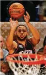  ?? Max Becherer / Associated Press ?? Rockets guard Eric Gordon takes aim during last year’s NBA 3-point competitio­n.