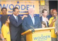  ?? Emilie Munson / Hearst Connecticu­t Media ?? U. S. Rep. John Larson, center right, at a campaign rally for Shawn Wooden, center left, candidate for state treasurer, in Hartford in August.