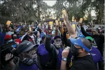  ?? STEPHEN B. MORTON - THE ASSOCIATED PRESS ?? In this Feb. 23photo, Ahmaud Arbery’s father, Marcus Arbery, bottom center, listens to Jason Vaughn speak during a memorial walk and candleligh­t vigil for Ahmaud at the Satilla Shores developmen­t, in Brunswick, Ga.