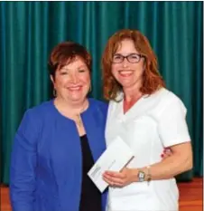  ?? SUBMITTED PHOTO ?? Delaware County Community College nursing program graduate Joyce Monigal of Glen Mills, right, receives the Women’s Auxiliary Award from Karen Weber, president of the Women’s Auxiliary.