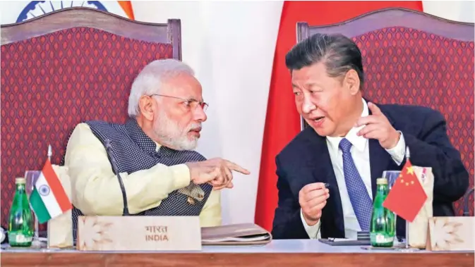  ??  ?? GOA: In this file photo, Indian Prime Minister Narendra Modi, left, talks with Chinese President Xi Jinping at the BRICS summit in Goa, India. — AP