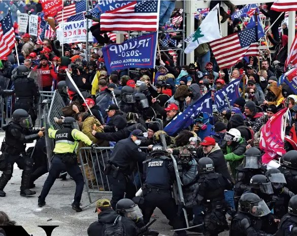  ??  ?? NO SYMPATHY
“The U.S. is experienci­ng what it has generated in other countries with its policies of aggression,” said the Maduro government in Venezuela of the mob that stormed the barricades around the Capitol (above)