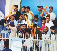  ?? Atiq Ur Rehman/Gulf News ?? Fans enjoying the action during the T10 League match between Bengal Tigers and Northern Warriors in Sharjah.
