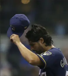  ?? Associated Press ?? Milwaukee’s Gio Gonzalez leaves in the seventh inning after pitching 3⅓ scoreless innings to earn the win.