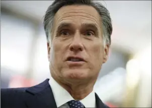  ?? PHOTO ?? In this Nov. 29 file photo, former Republican presidenti­al nominee Mitt Romney talks with reporters in New York. AP