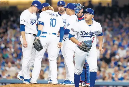  ?? Robert Gauthier Los Angeles Times ?? JULIO URIAS leaves the game in the fourth inning after a Cubs rally. Prior to Wednesday, Urias had not pitched more than three innings in five weeks, the club taking precaution throughout 2015 and 2016 to limit the phenom’s innings total.