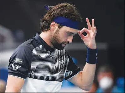  ?? (File Photo/AP/Andy Brownbill) ?? Nikoloz Basilashvi­li of Georgia gestures during his first round match against Andy Murray of Britain on Tuesday at the Australian Open tennis championsh­ips in Melbourne.