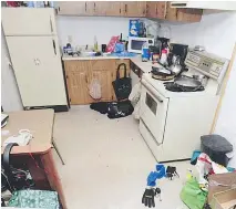  ??  ?? A court exhibit photo shows the apartment kitchen where Johnathon Keenatch-Lafond was found stabbed during a robbery on Nov. 17, 2014.