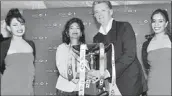  ??  ?? Patrick Gallagher, CEO for HSBC Sri Lanka and Maldives, handing over the Challenge Trophy to Niloo Jayatilake Overall Winner of HSBC's Inaugural Premier Golf Tournament 2013 held in Nuwara Eliya.