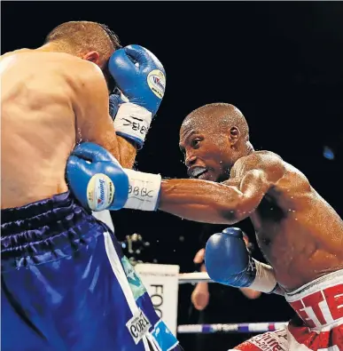  ?? Picture: REUTERS/JASON CAIRNDUFF ?? TELLING BLOW: Zolani Tete goes on the offensive against Omar Andres Narvaez in their WBO world bantamweig­ht title fight at the SSE Arena in Belfast, Northern Ireland, at the weekend