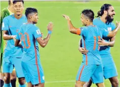  ??  ?? Indian football team captain Sunil Chhetri (2R) celebrates his team’s 4-1 victory during the 2019 AFC Asian Cup qualifying match between India and Macau held at the Kanteerava Stadium in Bangalore on October 11, 2017. - AFP photo