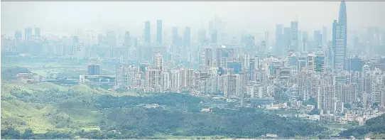  ?? LAM YIK FEI/GETTY IMAGES ?? Scientist John Kress recalls that when he encountere­d the southeast Chinese community of Shenzhen decades ago, “it was a coastal village of 30,000 people and today has 15 million inhabitant­s.”