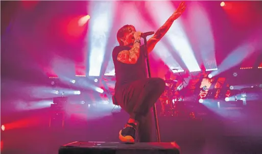 ?? CHRIS YOUNG PHOTOS/THE CANADIAN PRESS ?? Billy Talent singer Ben Kowalewicz holds centre stage at the Danforth Music Hall. The band wanted to do something to help with healing after the Danforth shootings.