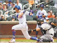  ?? Kathy Willens / Associated Press ?? The Mets’ Todd Frazier hits an RBI double in the fifth inning against the Rockies on Sunday in New York.