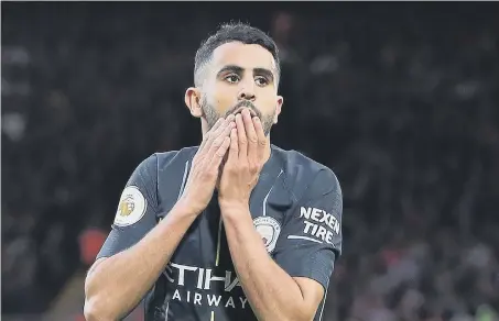  ??  ?? Riyad Mahrez reacts after his penalty miss at Anfield.