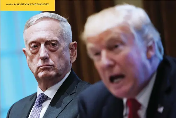  ?? MANDEL NGAN / AFP / GETTY IMAGES ?? President Donald Trump speaks as Defence Secretary James Mattis looks on in October 2017. Mattis is stepping down in February, noting his views don’t “align” with Trump’s.