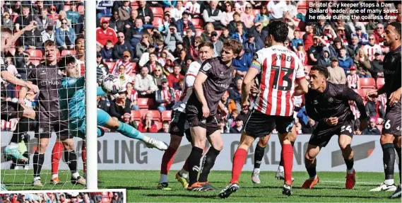  ?? ?? Bristol City keeper stops a Dan Ballard header, one of many saves he made during the goalless draw