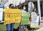  ?? PEDRO PORTAL pportal@miamiheral­d.com ?? Tenants from Hialeah protest rent hikes in front of the office of the Eco Stone Group, their landlord.