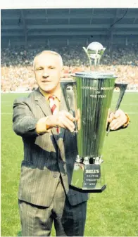  ??  ?? Winner Bill Shankly lifts Manager of the Year title in 1973