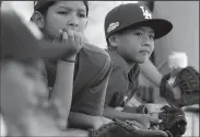  ?? LUIS SINCO/TRIBUNE NEWS SERVICE ?? Young fans wait to snag souvenir balls during batting practice before the start of Game 1 of the World Series between the Los Angeles Dodgers and the Houston Astros in Los Angeles on Oct. 24, 2017.