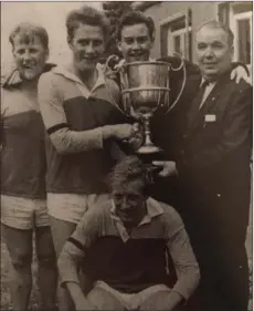  ??  ?? A youthful Jim Roice (front) in 1967, with Paddy O’Leary and Jas Kirwan also included as Sarsfields captain Tony O’Leary receives the Senior football championsh­ip trophy from Seán Browne, Co. Chairman.