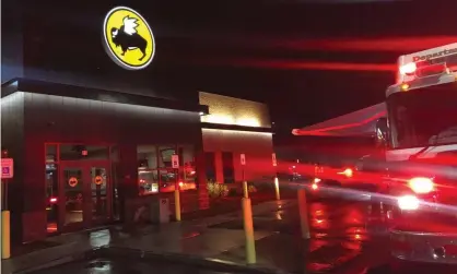  ??  ?? Emergency crews at the Buffalo Wild Wings restaurant in Burlington, Massachuse­tts. Photograph: John Guilfoil/AP