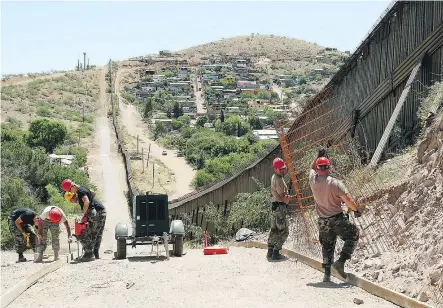  ?? — THE ASSOCIATED PRESS FILES ?? The National Guard has been building roads along the U.S.-Mexico border in Arizona. Now U.S. President Donald Trump wants to use the Pentagon’s budget to pay for a new border wall.