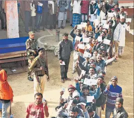  ?? ANI FILE ?? Voters wait to cast votes during the second phase of the Jharkhand assembly election at Karge village, Ranchi, on December 7.