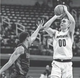  ?? JUNFU HAN/DETROIT FREE PRESS ?? Iron Mountain’s Foster Wonders shoots against Detroit Edison during the first half of an MHSAA Division 3 semifinal at the Breslin Center on March 14, 2019.