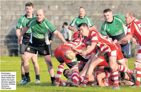  ??  ?? Pontyates scrum-half Dan Rees feeds the ball to his back division against Furnace United. Pictures: Phil Davies