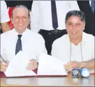  ?? ?? Deputy Prime Minister Fikri Ataoğlu, left, and Bellapais Culture and Unity Associatio­n president Ercan Küçük signing the ‘cooperatio­n protocol’