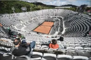  ?? (AFP) ?? People watch the match between Serbian Novak Djokovic against Spaniard Alejandro Davidovich on the central court at the Italian Open at Foro Italico in Rome, Italy, on Thursday.