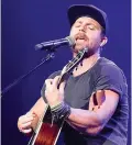  ?? Associated Press ?? ■ Kip Moore releases his new album “Wild World” in a very chaotic time, but he said his introspect­ive messages might help people right now.