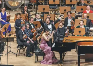  ?? XINHUA ?? Musicians from the New York Philharmon­ic perform during a concert celebratin­g the Chinese New Year at Lincoln Center’s David Geffen Hall in New York on Tuesday.