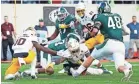  ?? GETTY IMAGES ?? ASU’s Eno Benjamin stretches the ball over the goal line for a touchdown in the fourth quarter Saturday.