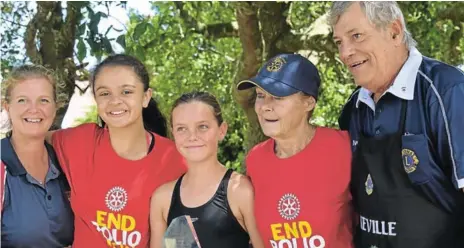  ??  ?? SWIMMING CHAMPS: Congratula­ting the winning team at the Rotary Swim-a-thon are, from left, Melissa Tweedie, Sheena Louca, Scarlett Tweedie, who received the trophy on behalf of her team, with Tina Hon of Rotary E-Club and Neville Williamson of the Lions Club