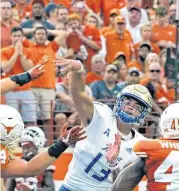  ?? [AP PHOTO] ?? Tulsa quarterbac­k Luke Skipper, center, will lead the Golden Hurricane on Saturday against Arkansas State.