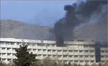  ?? RAHMAT GUL, THE ASSOCIATED PRESS ?? People try to escape from a balcony of the Interconti­nental Hotel during an attack in Kabul, Afghanista­n, on Sunday.